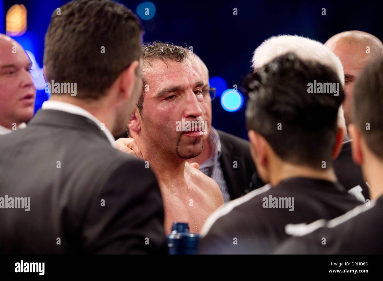 Stuttgart, Germany. 26th Jan, 2014. German boxer Firat Arslan reacts after loosing against Marco Huck in their World boxing Organization (WBO) Cruiserweight Championship match at Schleyer Hall in Stuttgart, Germany, 26 January 2014. Challenger Firat Arslan lost by technical k.o. in the sixth round. Photo: SEBASTIAN KAHNERT/dpa/Alamy Live News Stock Photo