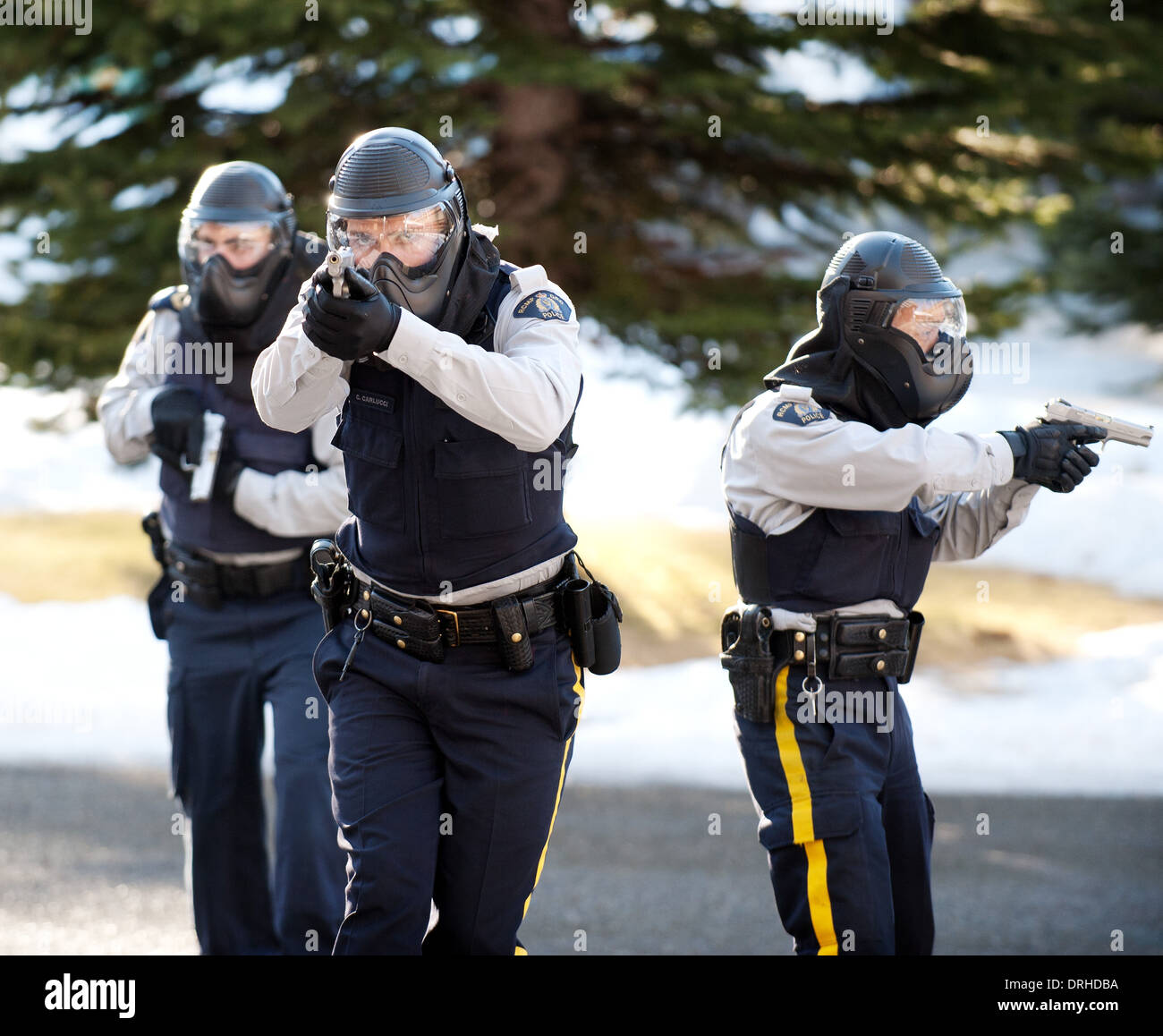 RCMP police officers take part in an active threat training exercise in SWAT, IRT and tactical response, at a high school. Stock Photo