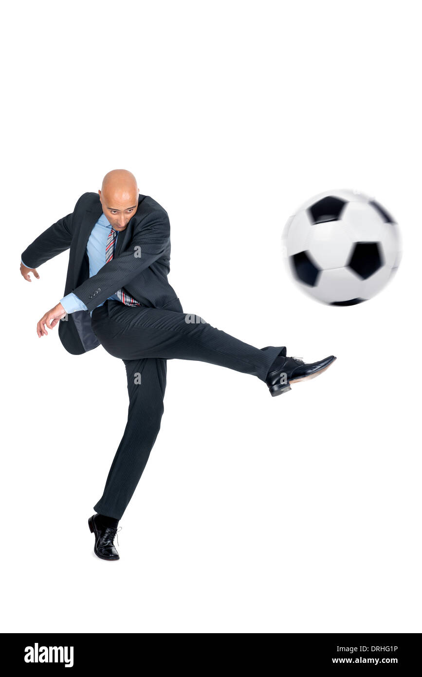 Businessman playing soccer ball isolated in white Stock Photo - Alamy