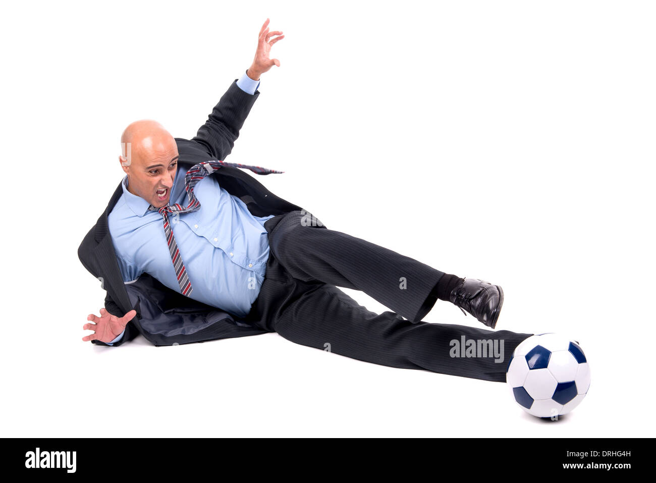 Businessman playing soccer ball isolated in white Stock Photo - Alamy