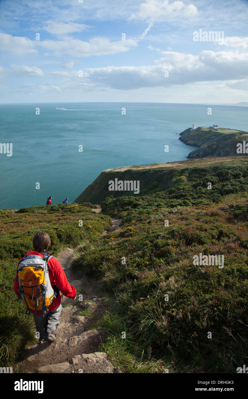 Walker heading towards Baily Lighthouse, Howth Coastal Path, County
