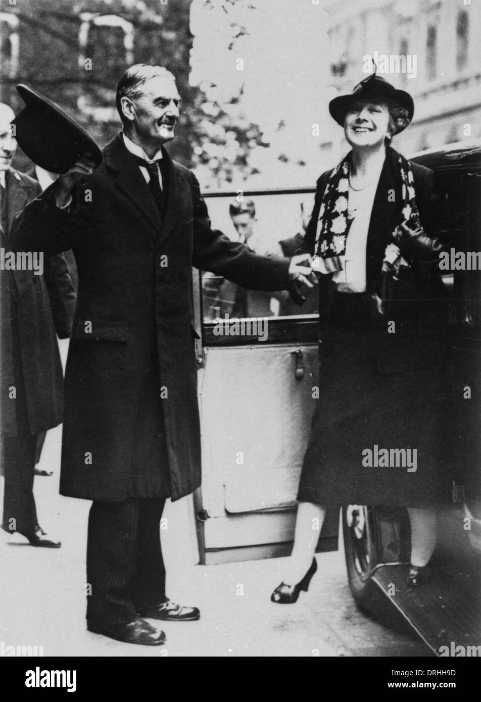 Neville Chamberlain helping his wife out of a car Stock Photo