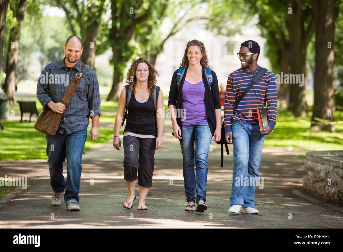 Multiethnic University Students Walking On Campus Stock Photo - Alamy