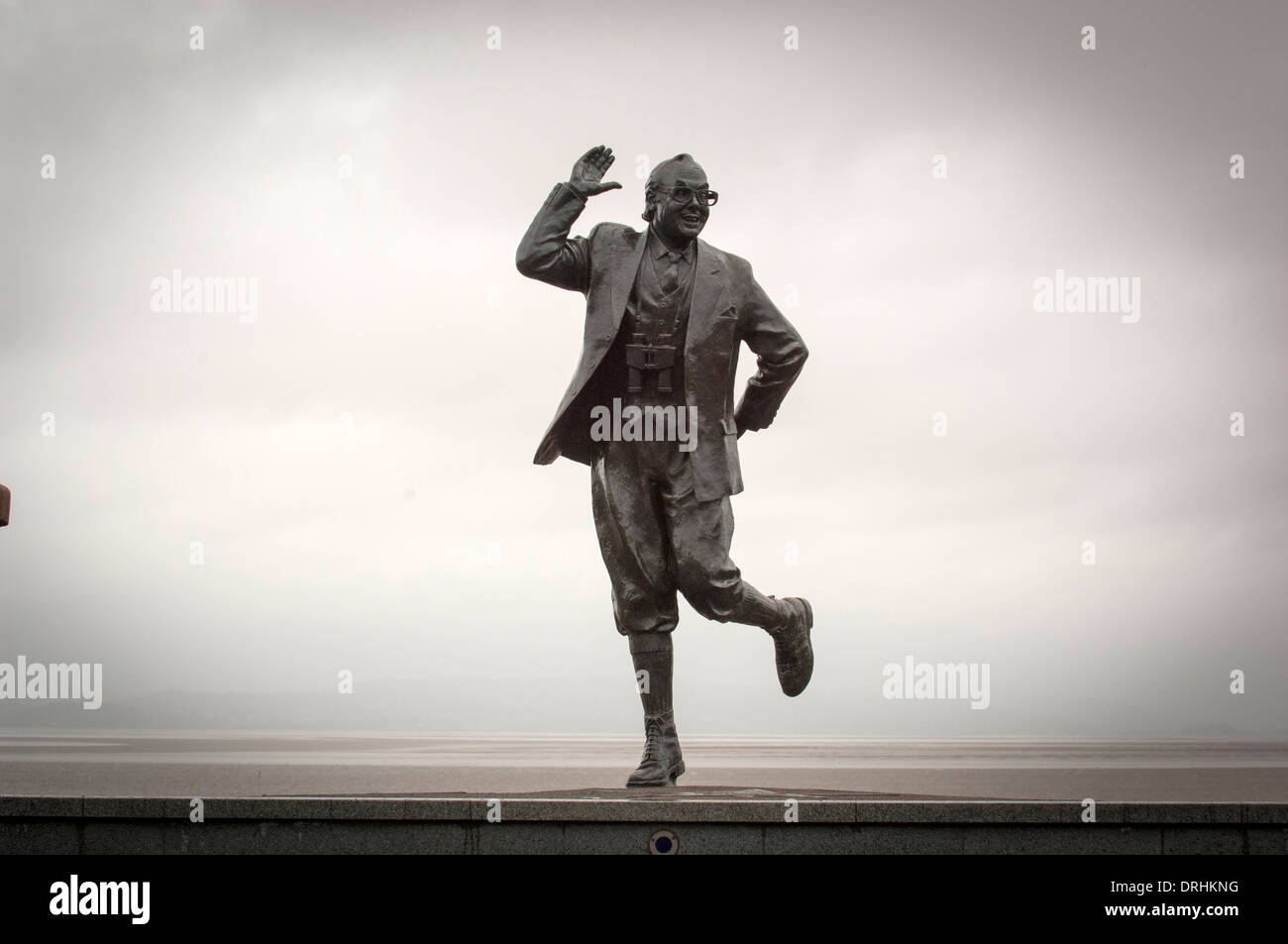The life-sized statue of British comedian Eric Morecambe in one of his characteristic poses at Morcambe Bay,Lancashire,UK. Stock Photo