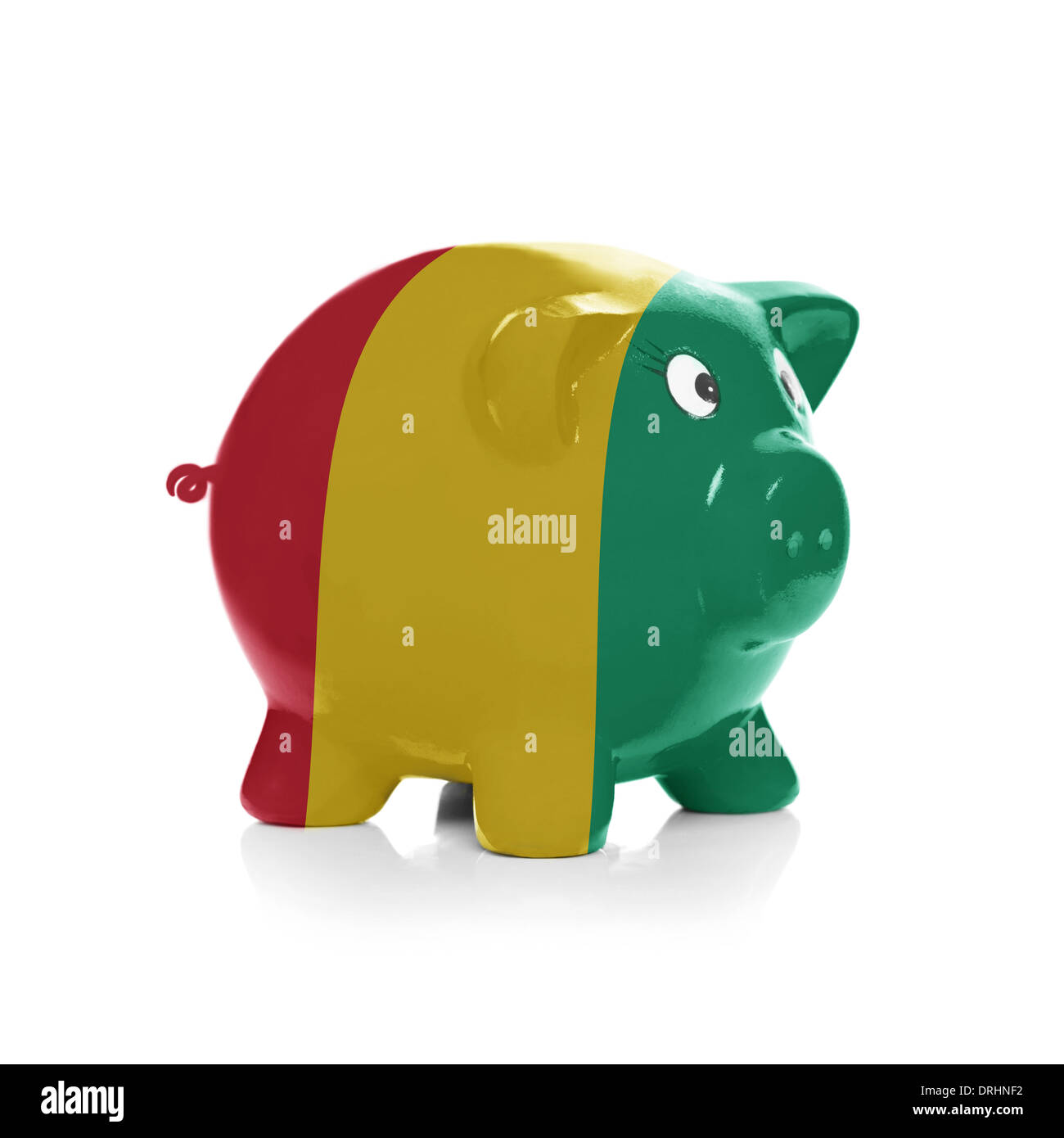 Green piggy bank with dollars sticking out - isolated on white ...