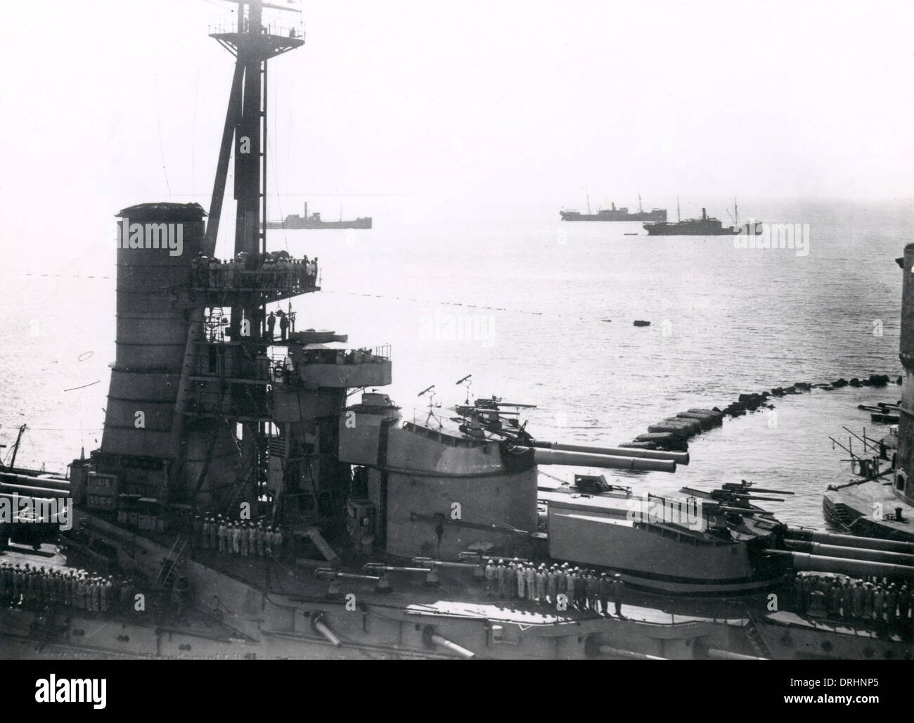 Italian dreadnought battleship entering Taranto harbour Stock Photo