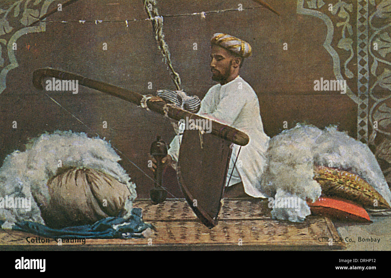 Indian man cleaning cotton Stock Photo