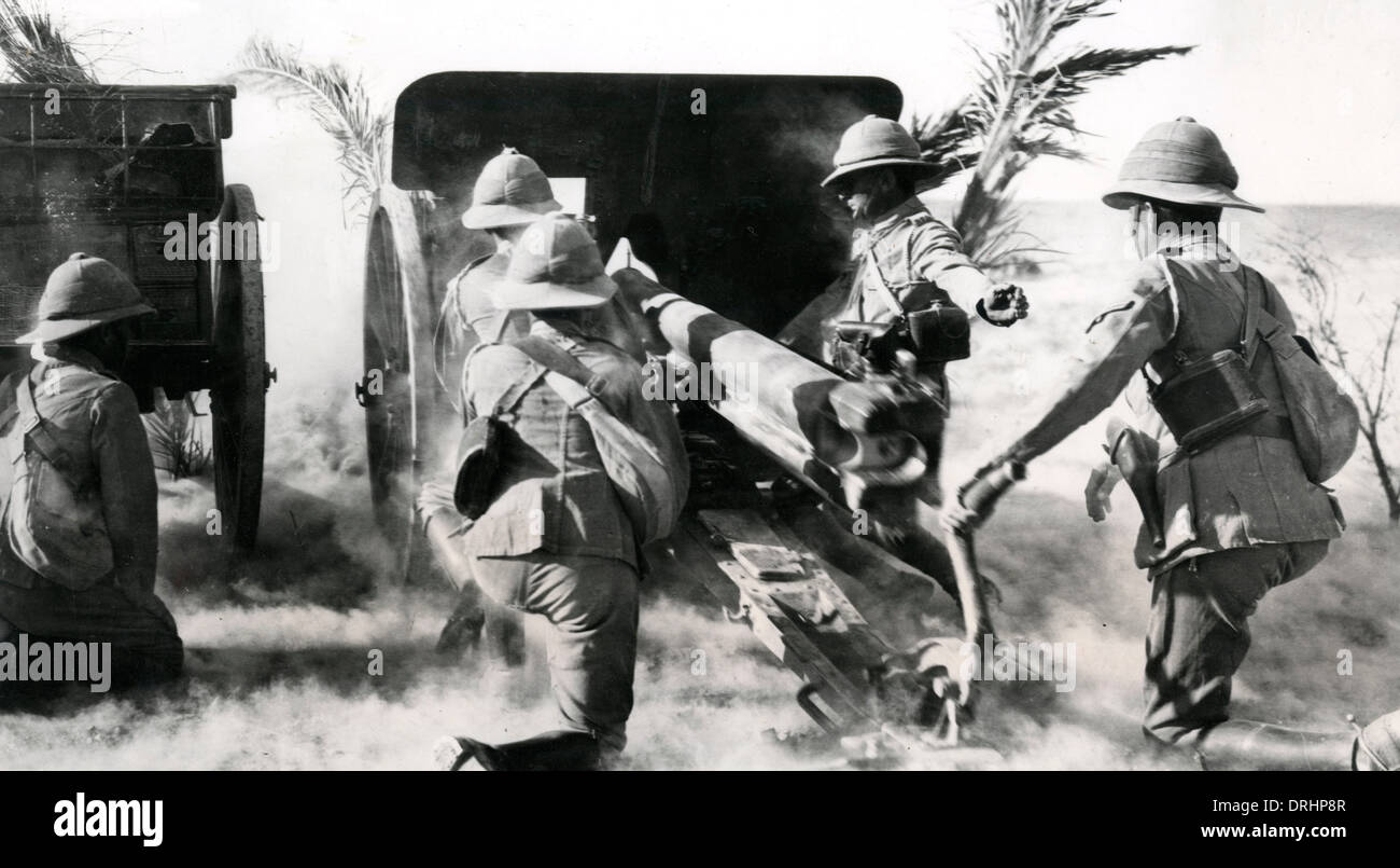 British gunners firing captured gun in the desert, WW1 Stock Photo