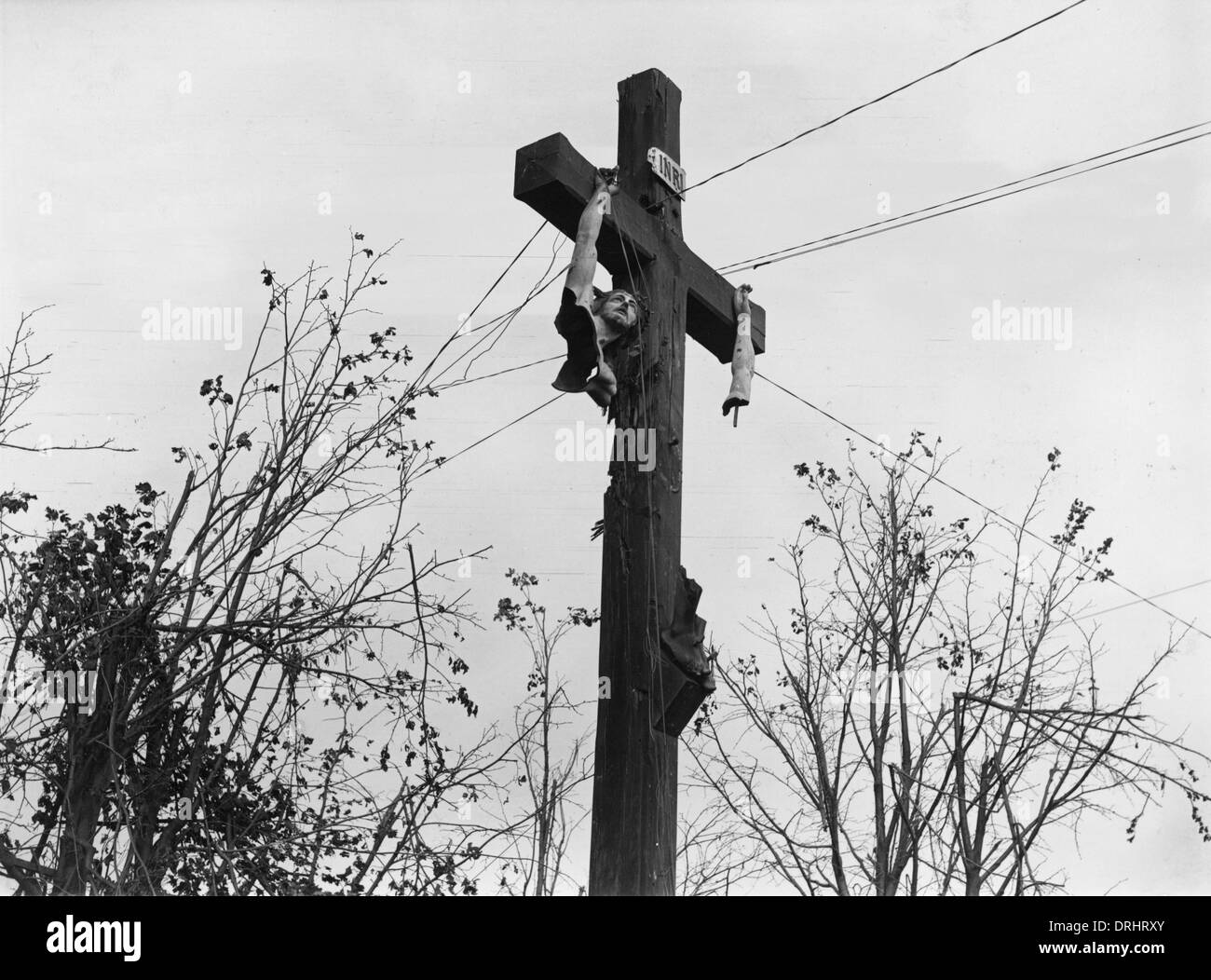 Damaged wayside crucifix near Bellenglise, France, WW1 Stock Photo