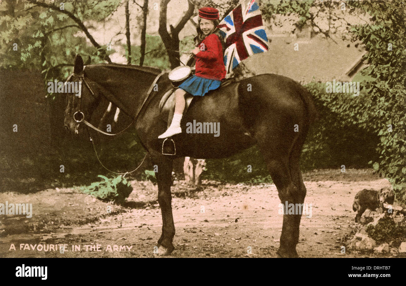 Little Patriotic Girl astride a cavalry horse Stock Photo