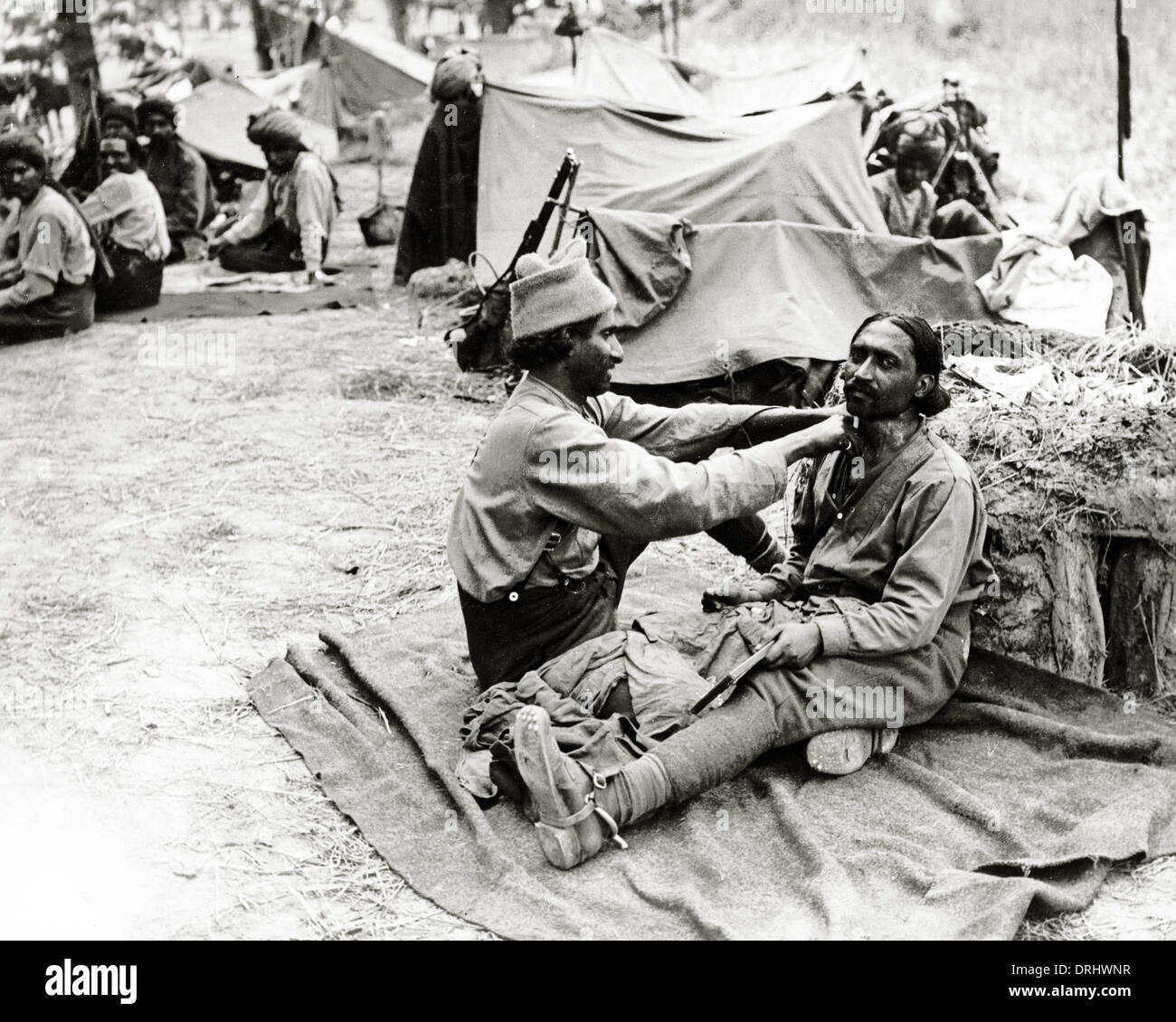 Indian barber at work, Western Front, WW1 Stock Photo