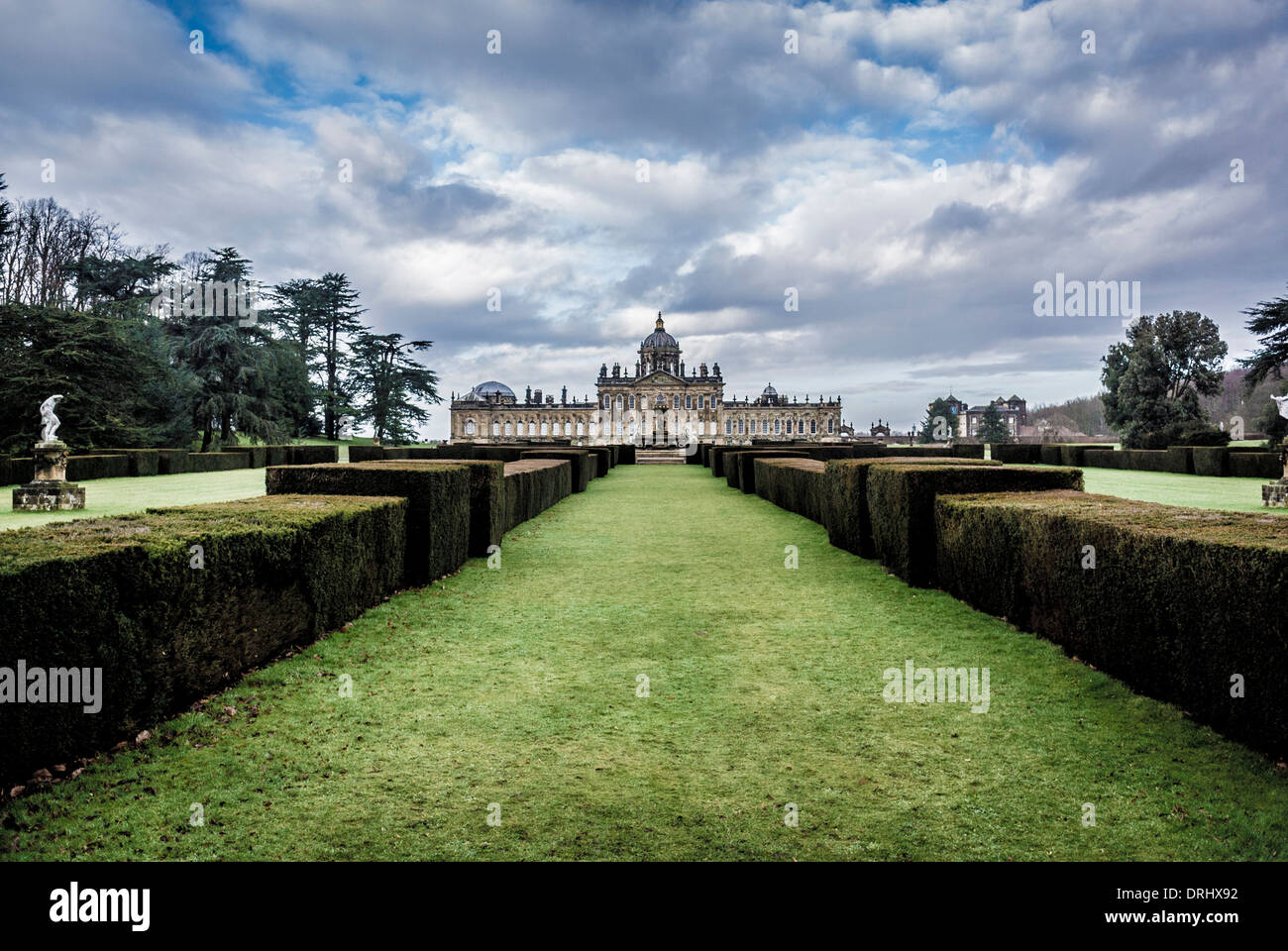 Formal hedges leading to the Atlas fountain on the south façade of Castle Howard, North Yorkshire. Stock Photo