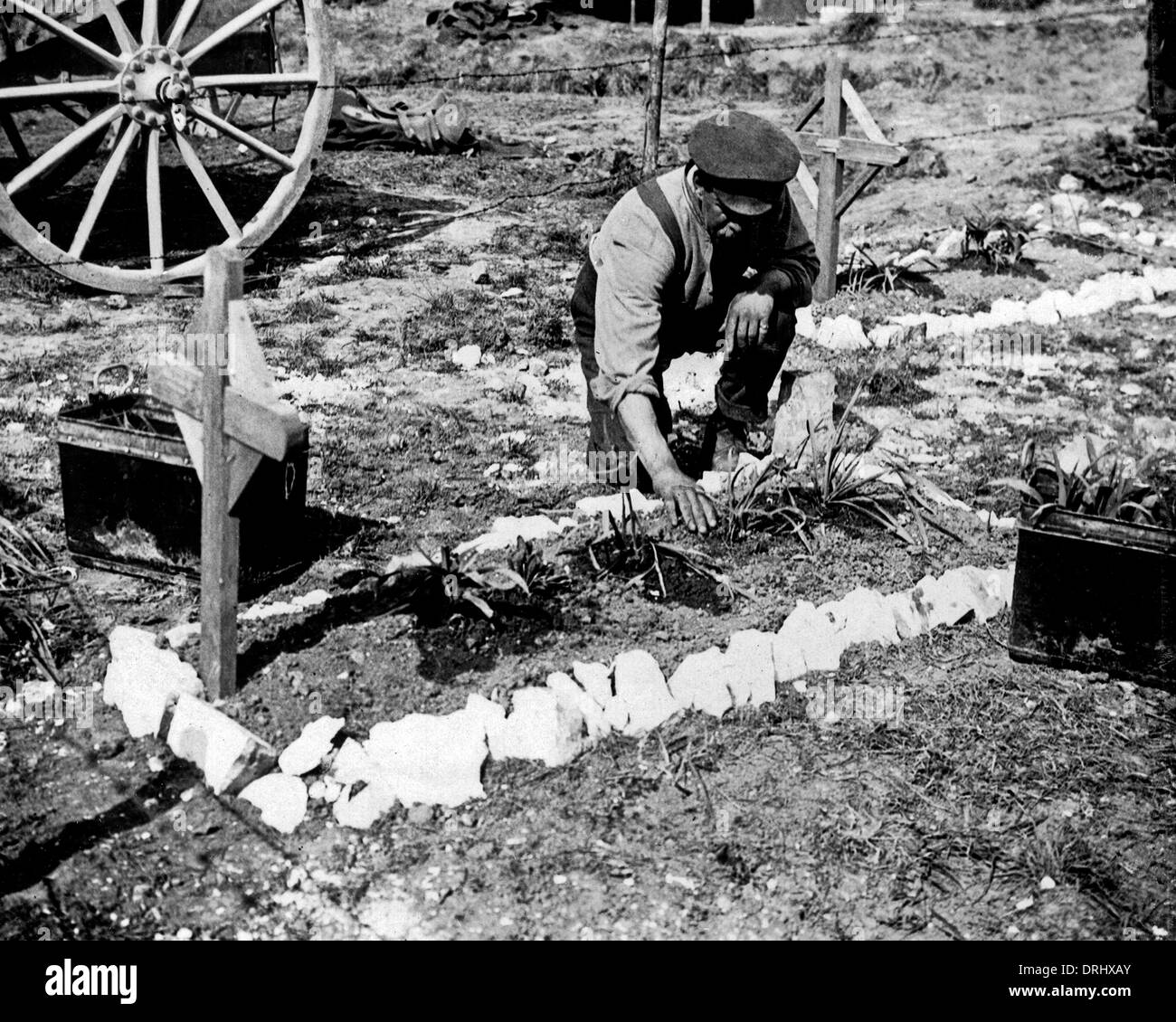 British soldier tending grave of fallen colleague, WW1 Stock Photo