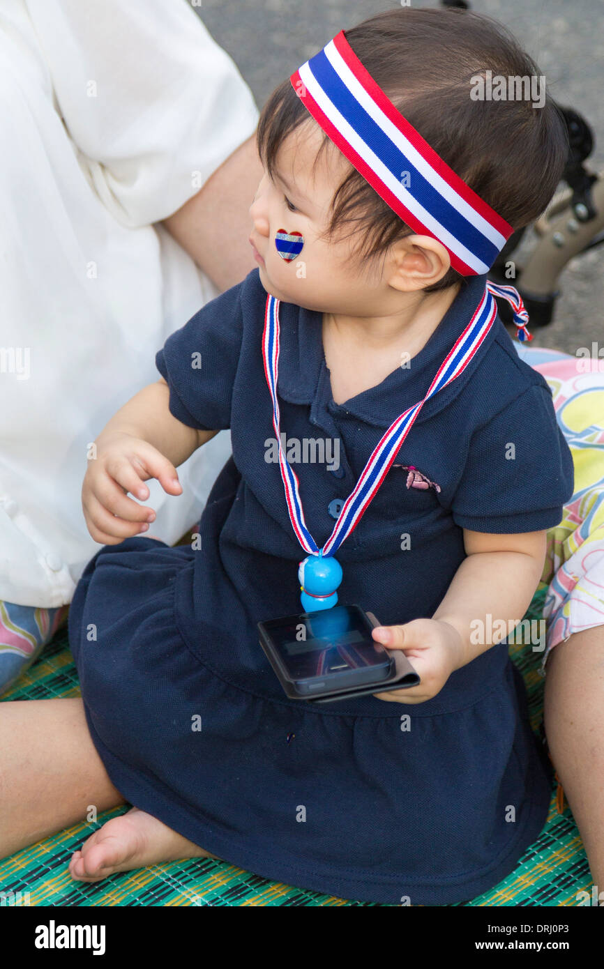 Baby at political demonstration, Bangkok, Thailand Stock Photo