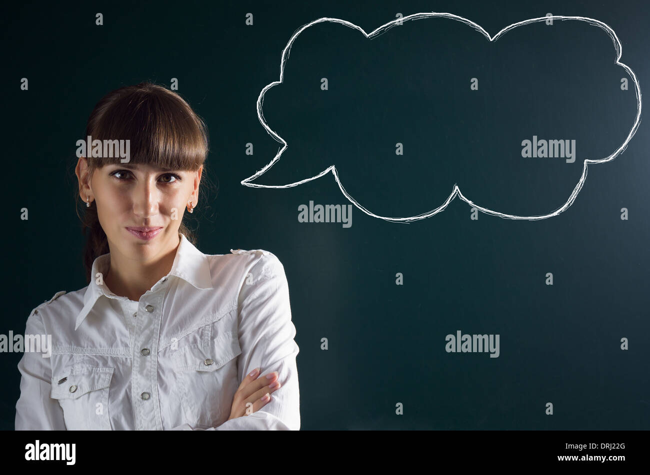 Beautiful girl with sketch thought bubble speech balloon at chalkboard black background Stock Photo