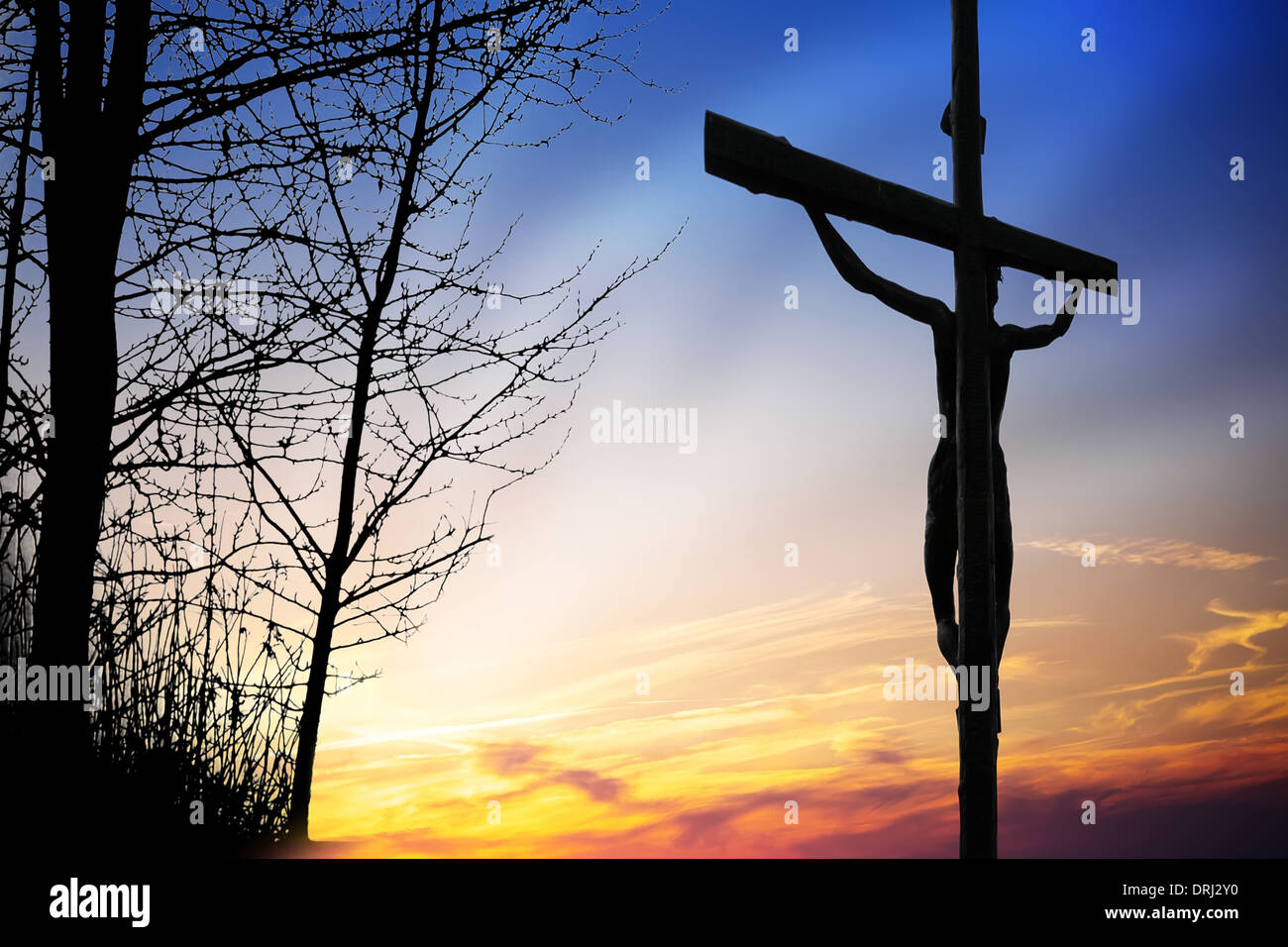 Jesus on the cross at sunset Stock Photo - Alamy