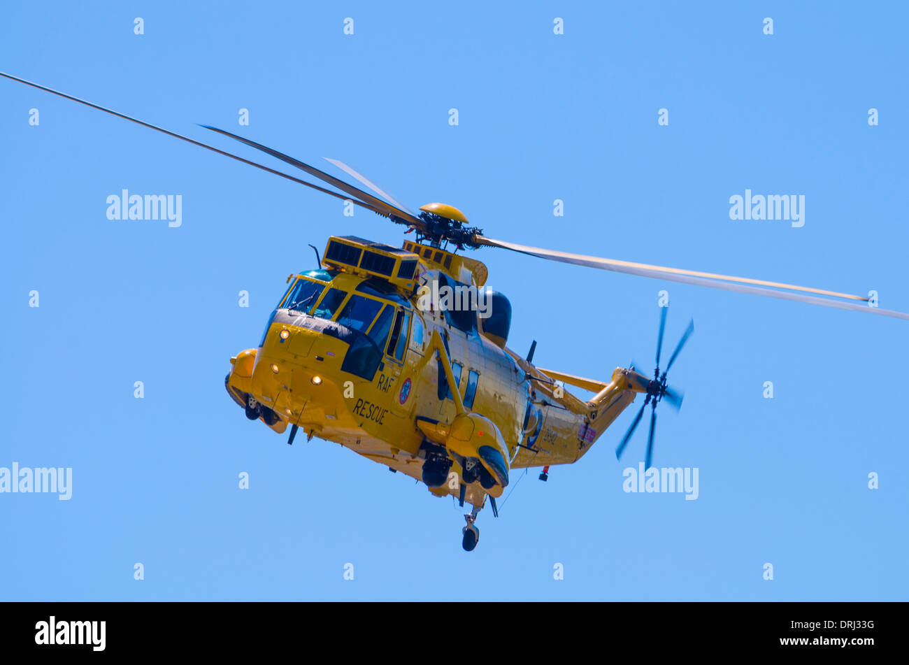 Westland Sea King WS-61 HAR3A RAF Search and Rescue Helicopter in flight against a blue sky. Stock Photo
