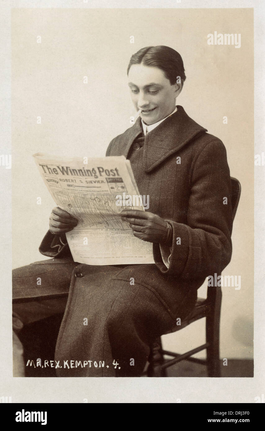Gentleman with his copy of The Winning Post Stock Photo