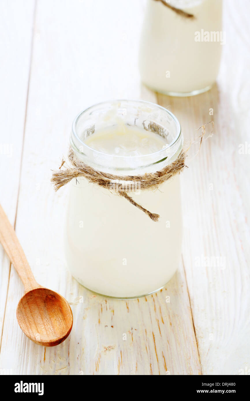 yogurt in a glass jar, food closeup Stock Photo