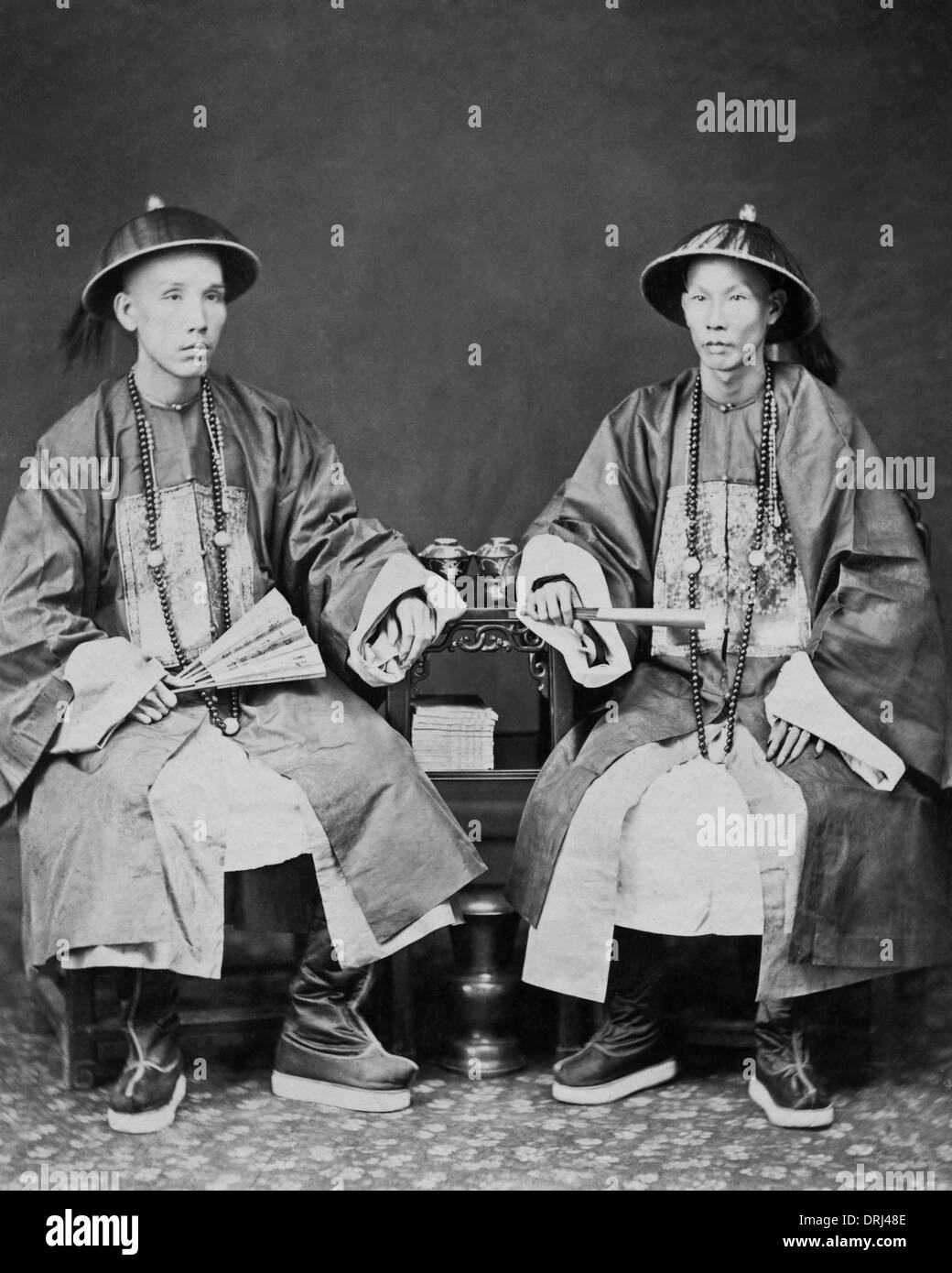 Chinese men seated Black and White Stock Photos & Images - Alamy