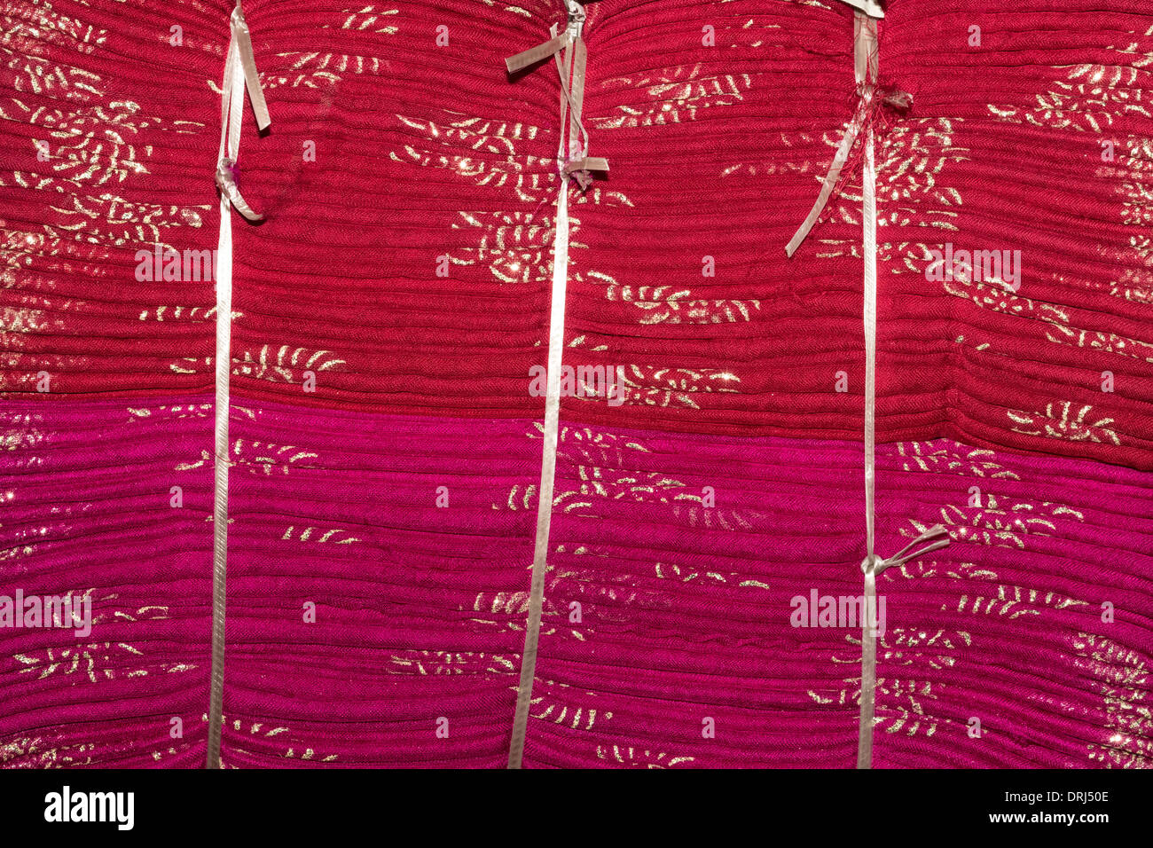 India, Rajasthan, Jodhpur, textiles, stack of bundled cotton scarves