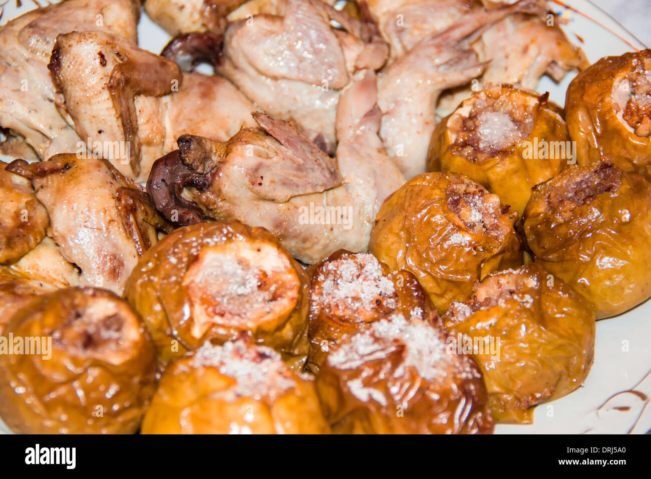quail on apples with honey and nuts Stock Photo