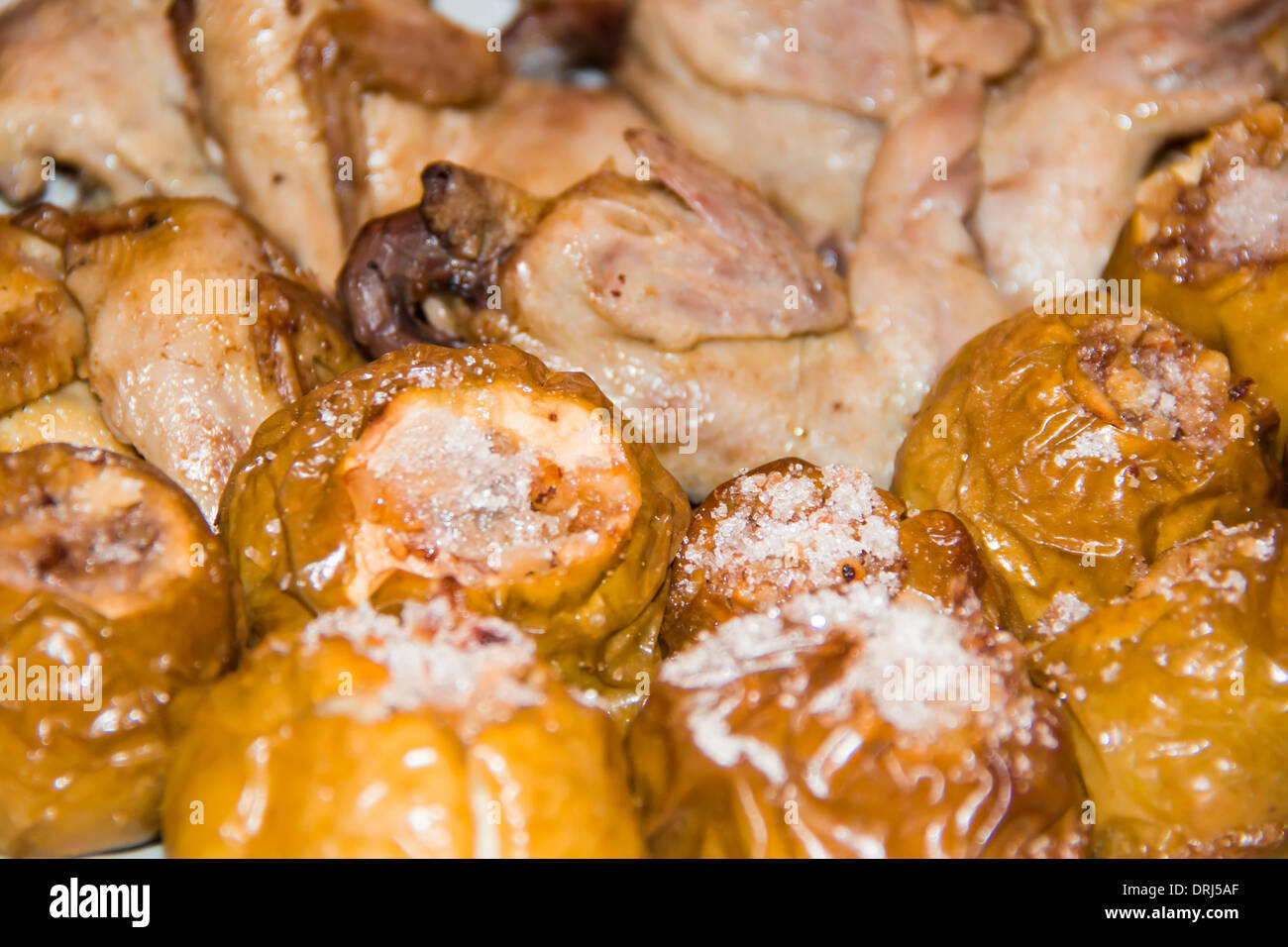 quail on apples with honey and nuts Stock Photo