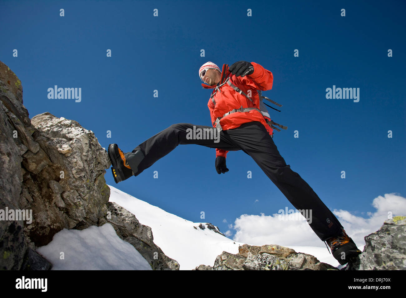 Man climbs in the rock, Mann klettert am Felsen Stock Photo