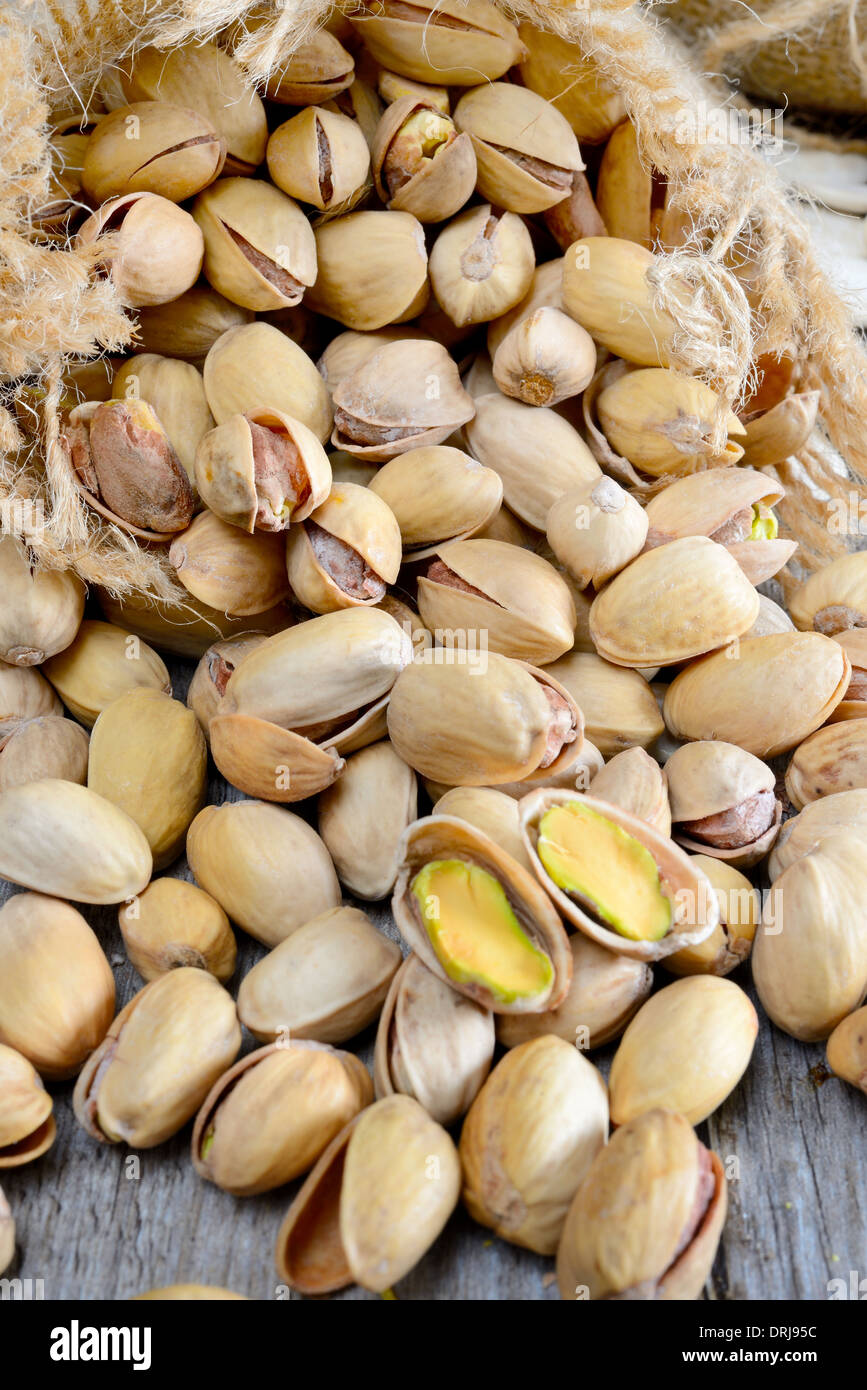 dried fruits pistachios salted in jute sack Stock Photo