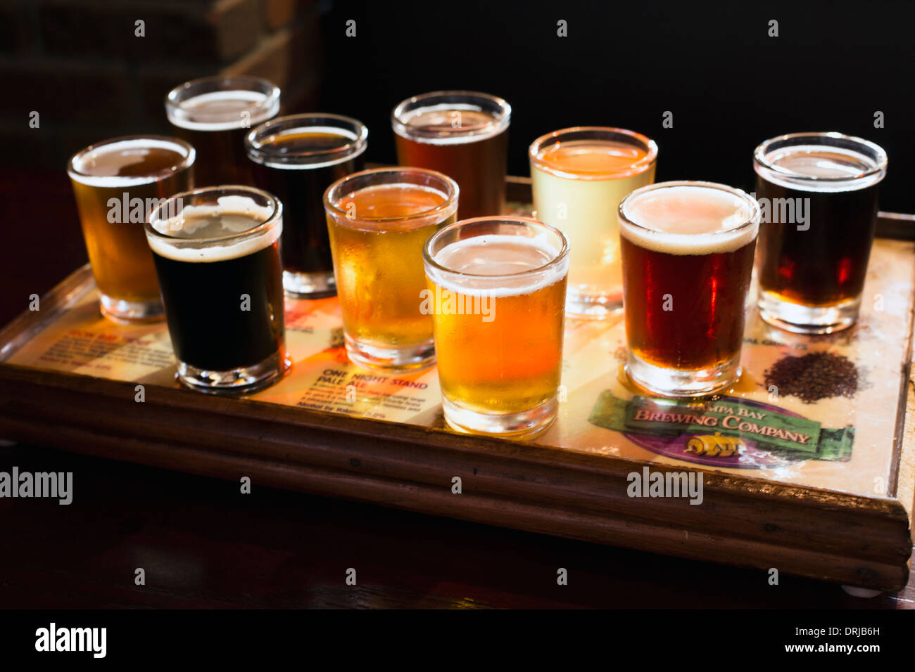 flight of beers for tasting in a brew pub Stock Photo
