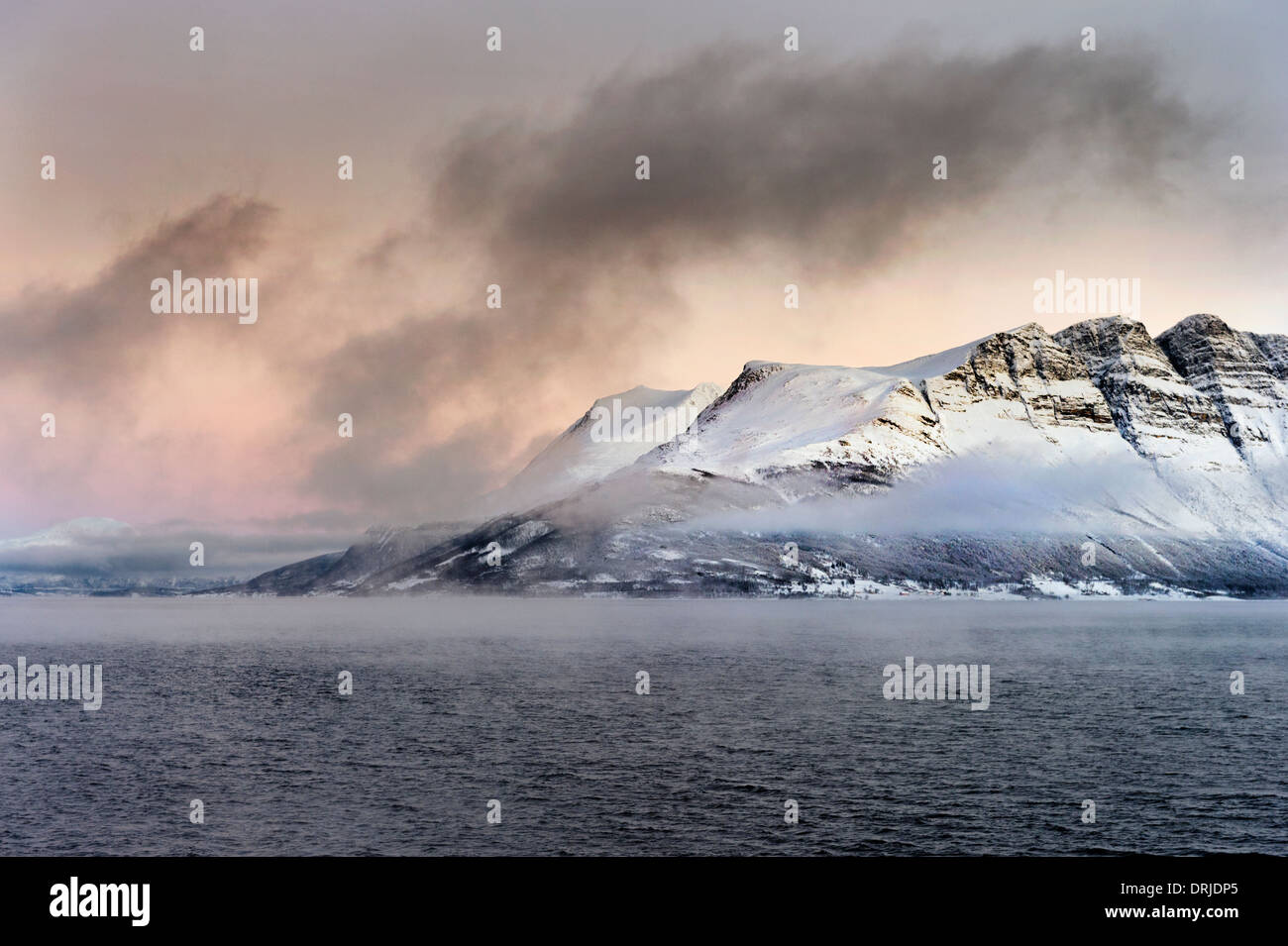 The Norwegian fiord coastline between Finnsnes and Tromsø, Norway, seen in Winter Stock Photo