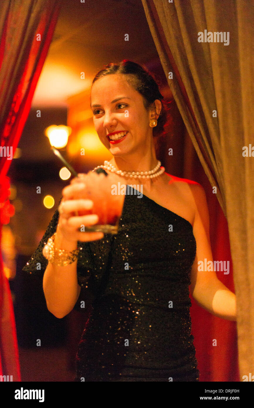 USA,Florida,Tampa,Ciro's Speakeasy and Restaurant, waitress serving a drink Stock Photo