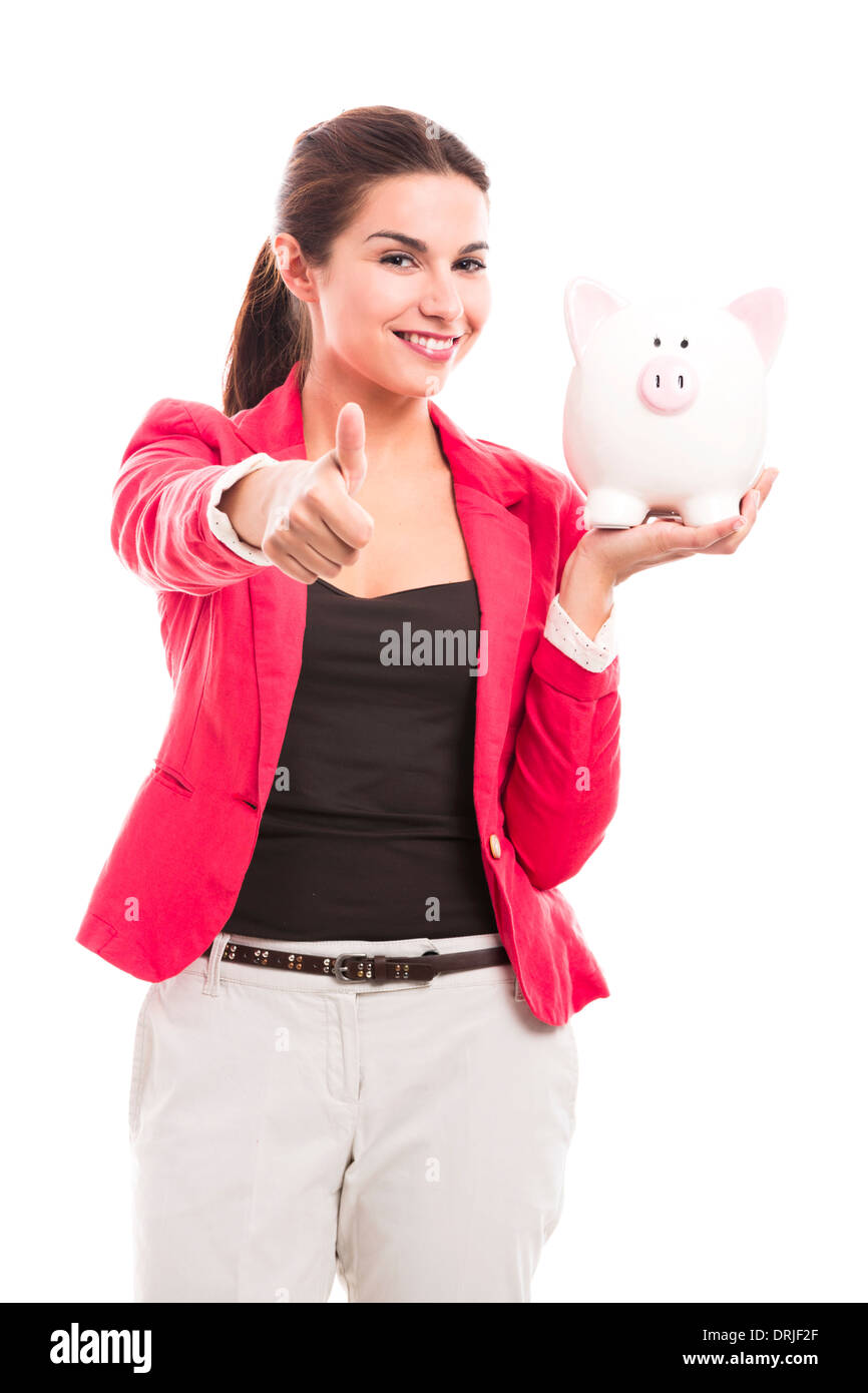 Business woman holding a piggy bank and doing thumbs up, isolated over ...