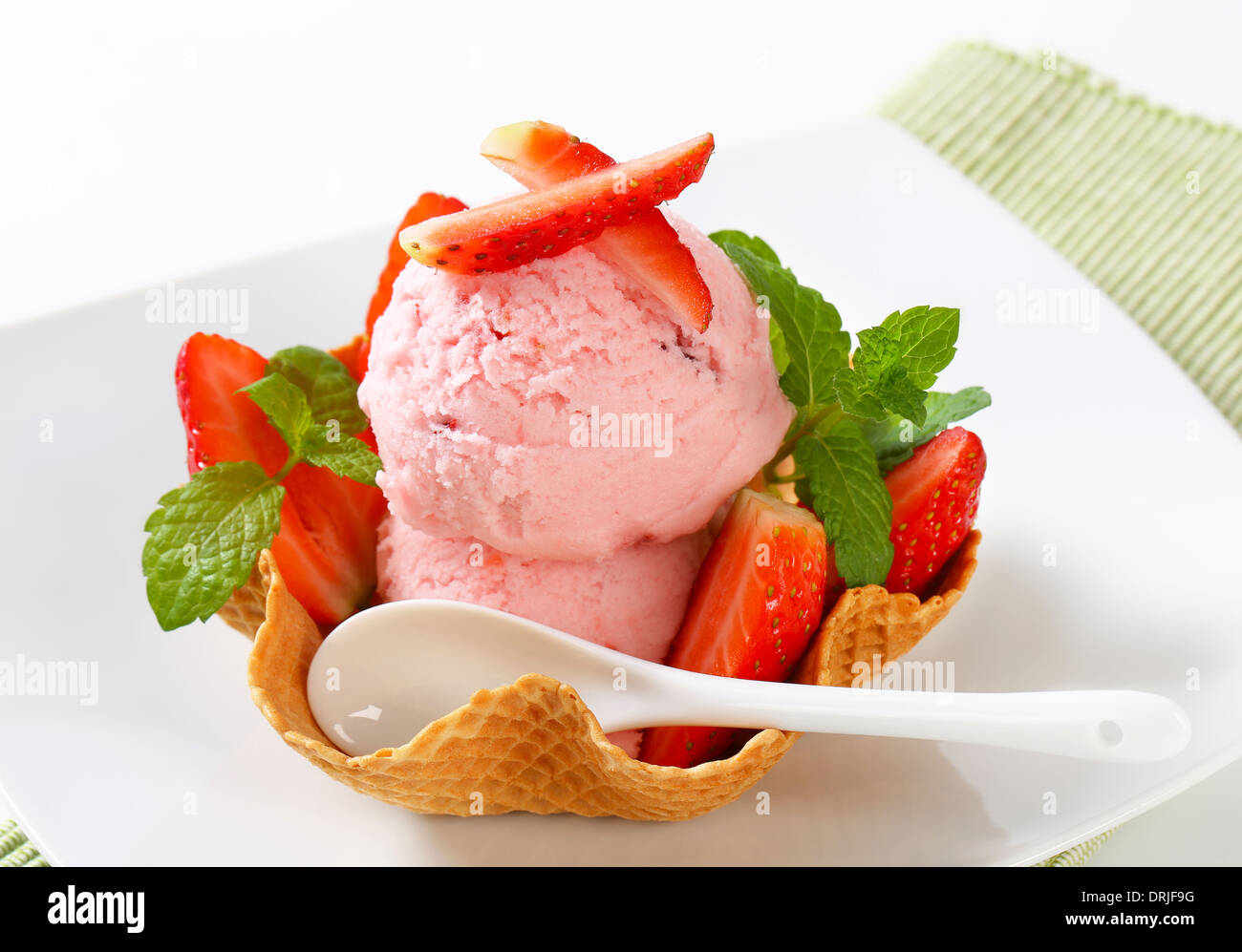 Scoops of strawberry ice cream in waffle basket Stock Photo