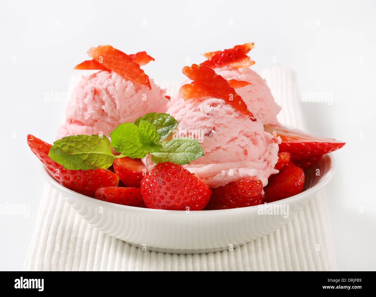 Scoops of strawberry sherbet with fresh fruit Stock Photo