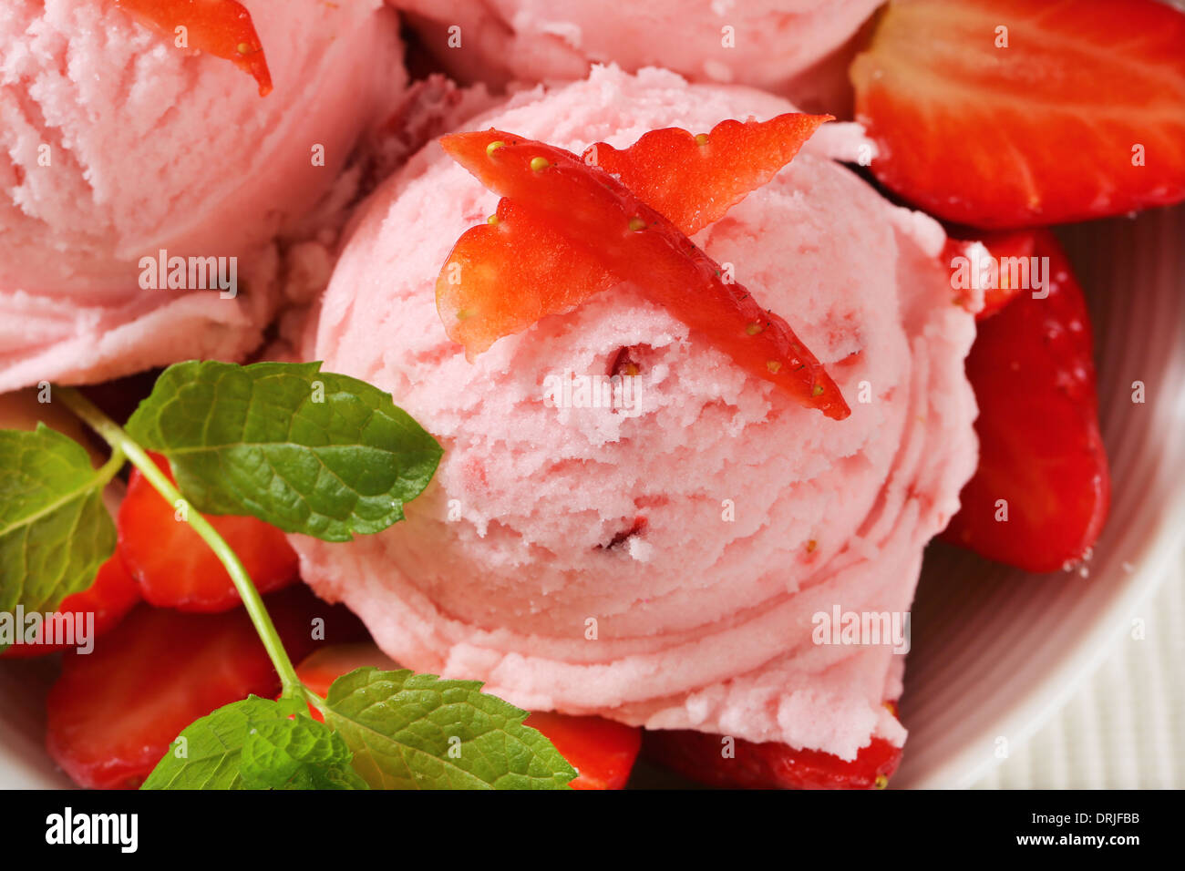 Scoops of strawberry sherbet with fresh fruit Stock Photo