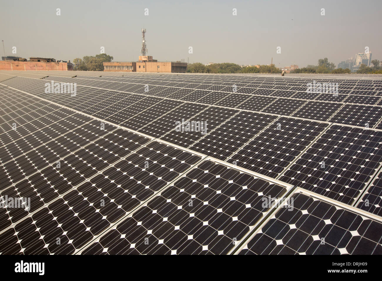 A 1 MW solar power station run by Tata power on the roof of an electricity company in Delhi, India. Stock Photo