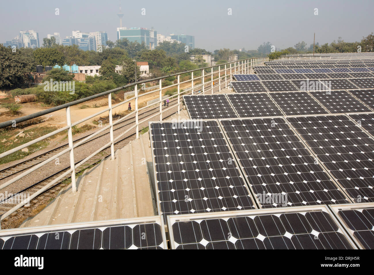 A 1 MW solar power station run by Tata power on the roof of an electricity company in Delhi, India. Stock Photo