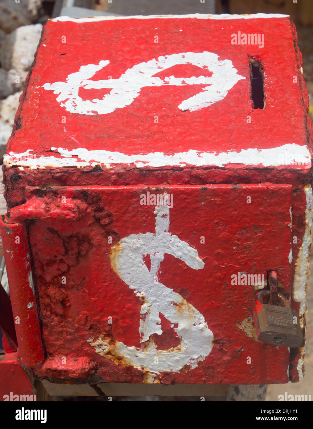 Dollar signs painted on side of metal honesty box money box at stall