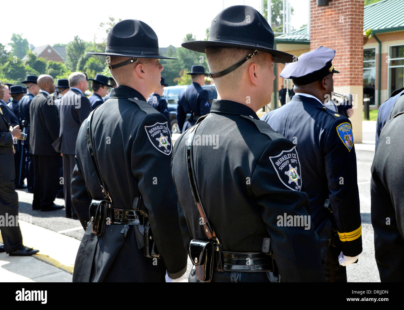 Police standing at attention during a policeman's funeral Stock Photo