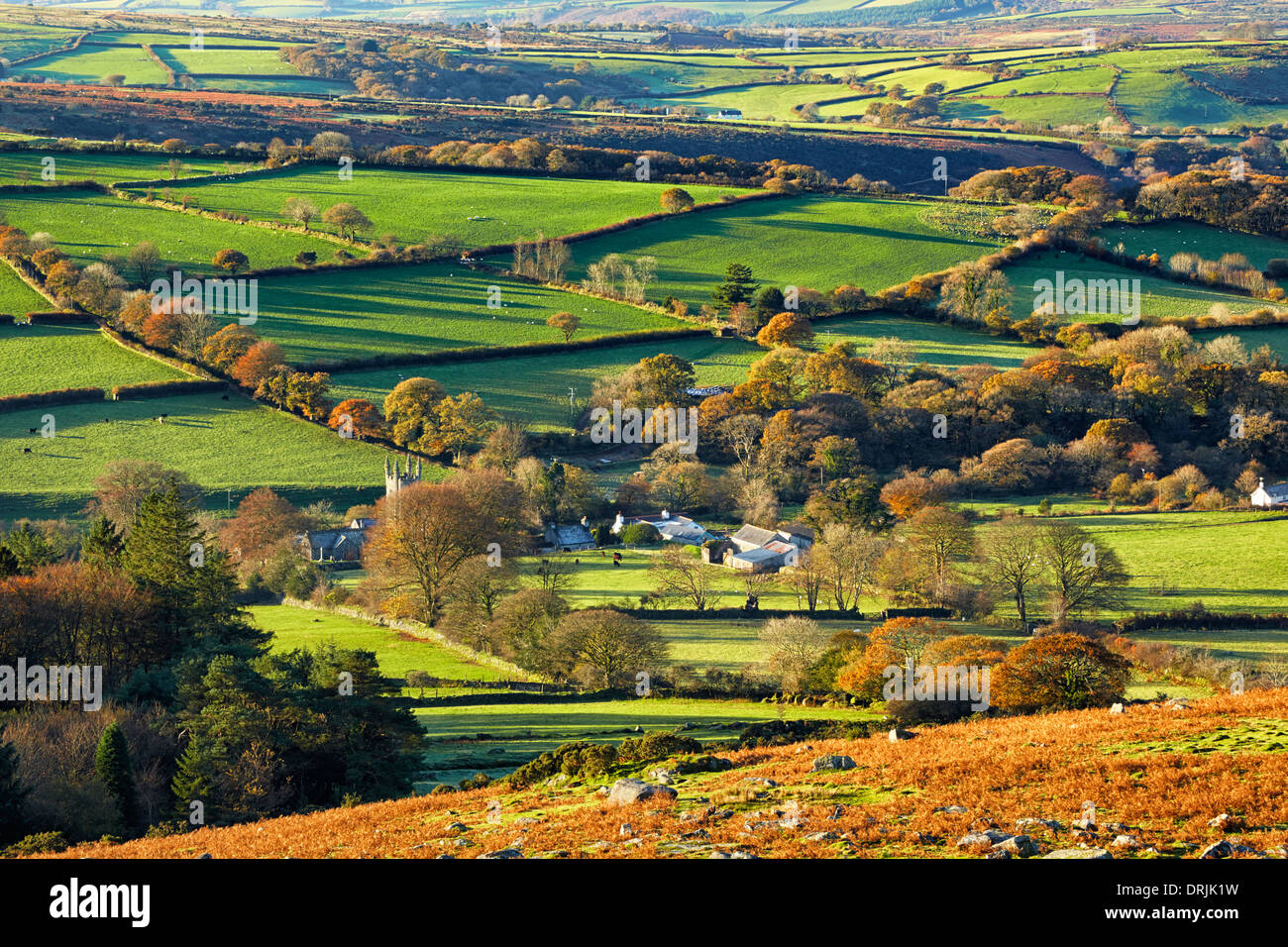 An autumnal view overlooking the patchwork landscape of Dartmoor and Sheepstor Village Stock Photo