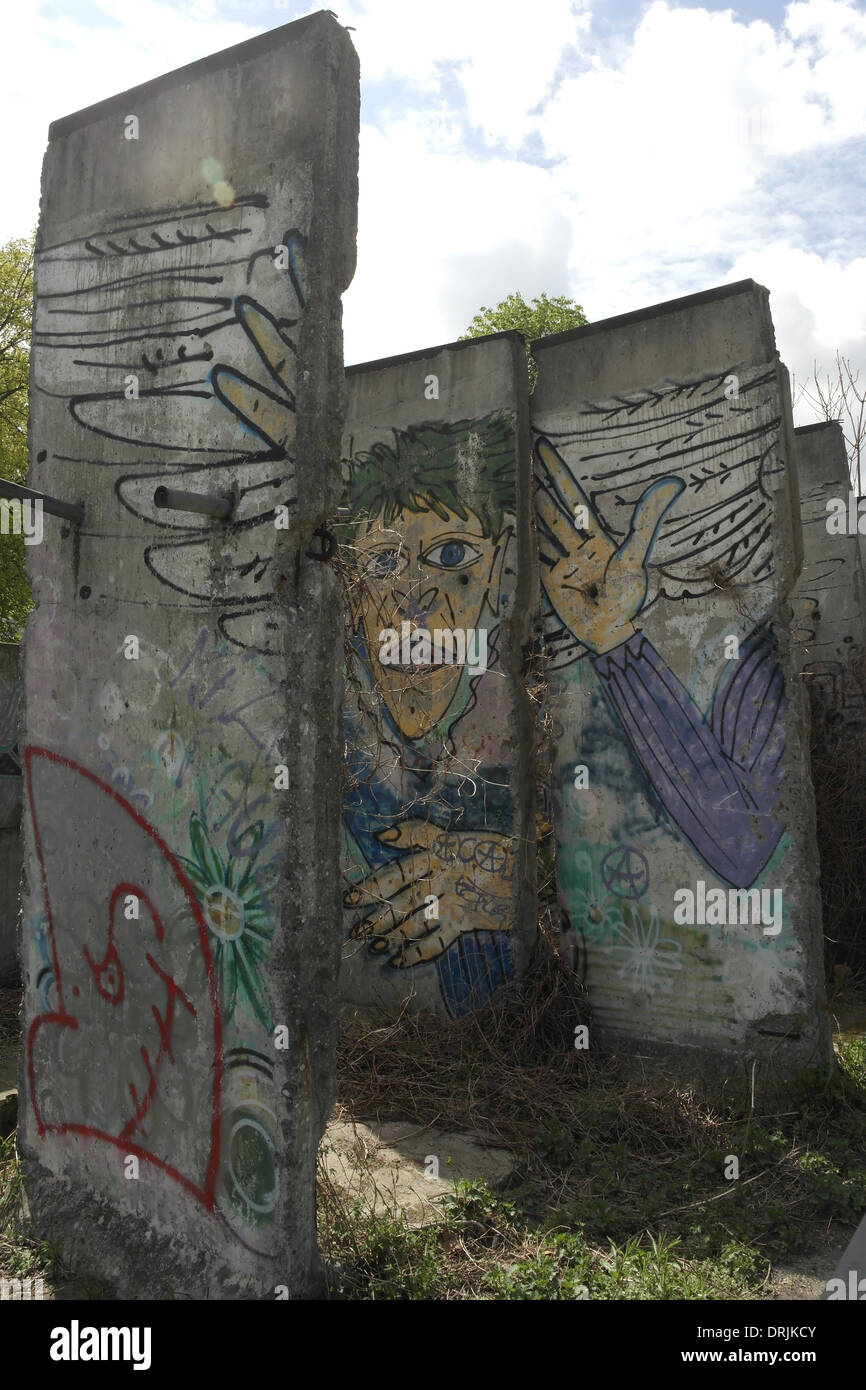 Graffiti segments Berlin Wall, removed in 1997 from World War 2 graves