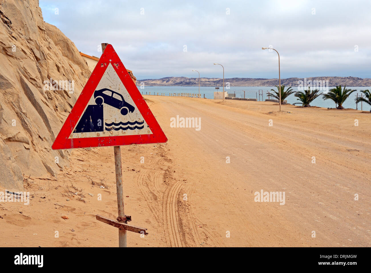 Warning for drivers before the fall in the water in Luederitz, Namibia, Africa, Warnschild fuer Autofahrer vor dem Absturz ins W Stock Photo