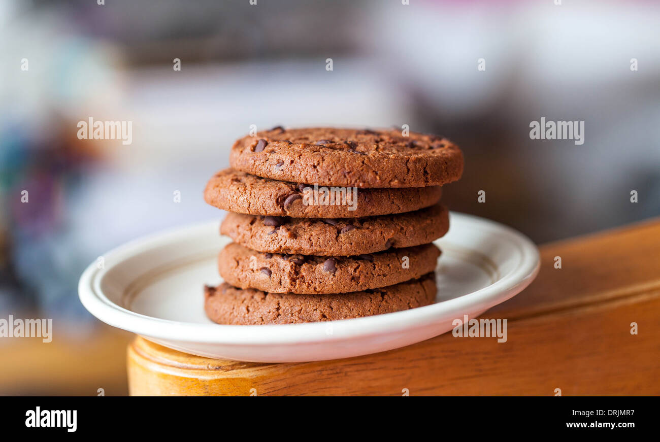 Pile of chocolate chip cookies on a plate Stock Photo