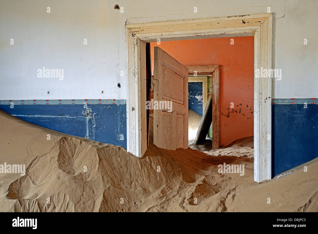 from dunes and desert sands taken residential buildings, working buildings in the former diamond town of Kolmanskuppe, Kolmansko Stock Photo