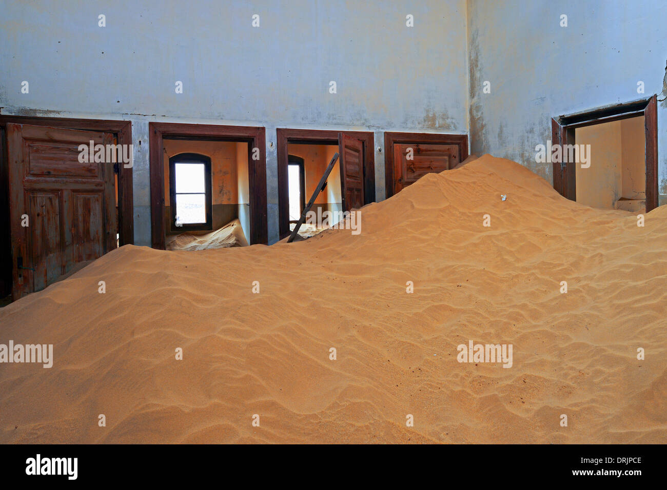from dunes and desert sands taken residential buildings, working buildings in the former diamond town of Kolmanskuppe, Kolmansko Stock Photo