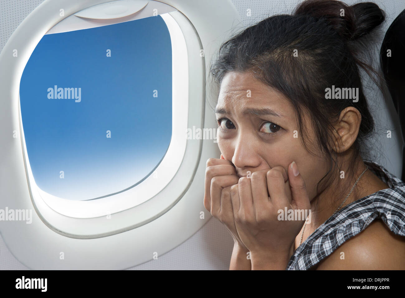 Scared passenger on plane hires stock photography and images Alamy