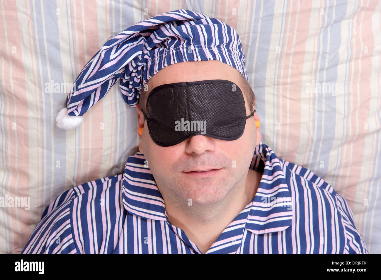 man sleeping with a mask on eyes Stock Photo Alamy