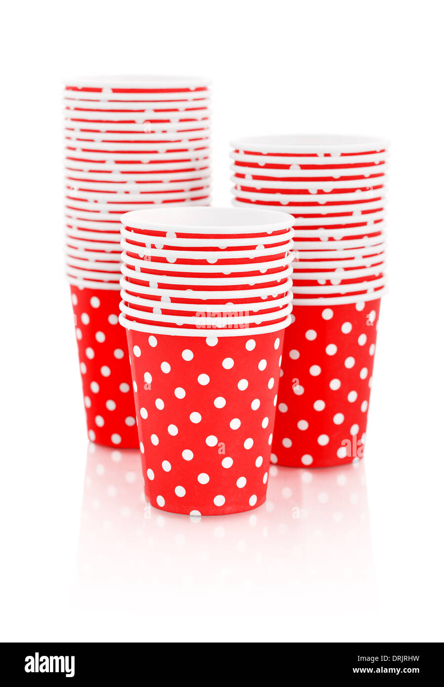 Red polka dot paper cups isolated on white. Stock Photo