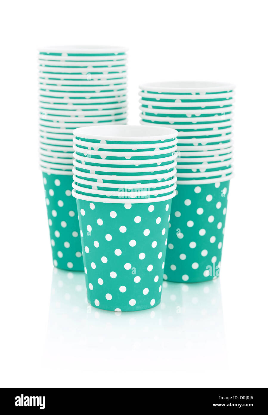 Blue polka dot paper cups isolated on white.  Stock Photo